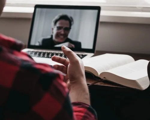Man at desk on video call